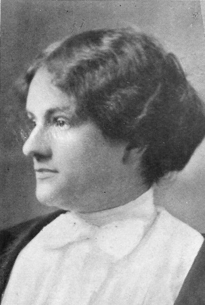 Dorothy McIlwraith, head-and-shoulders portrait in left profile, wearing a white high-collared blouse